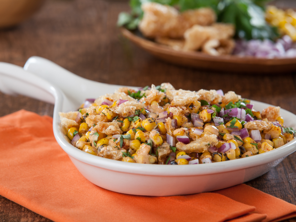 Sweet corn salsa it a white serving dish